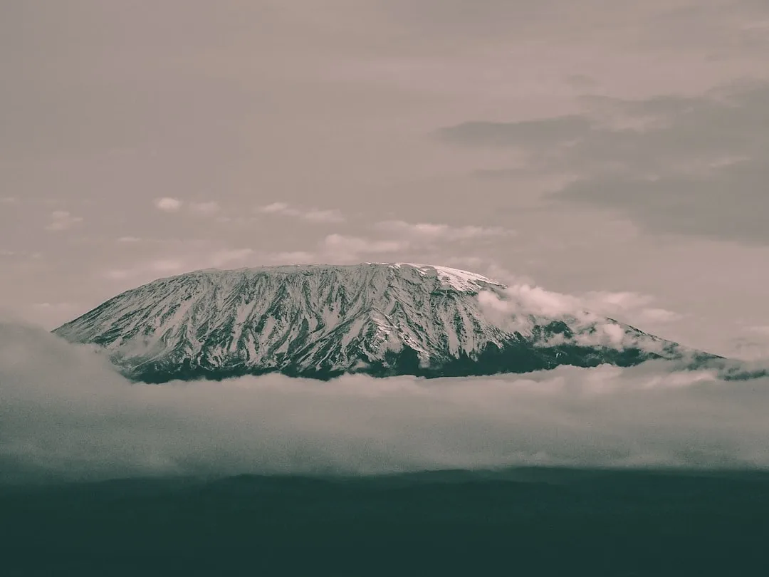 The snow-capped massif of Kilimanjaro above a sea of cloud