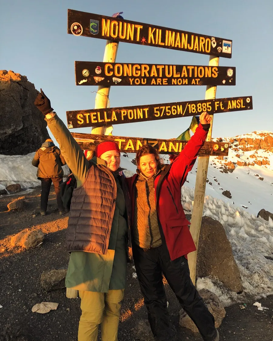 Two climbers celebrating at Stella Point, 5,756 m